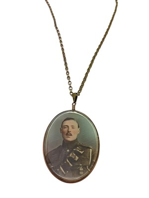 Lot 131 - Large WWI period 9ct rose gold mounted oval portrait glazed locket on a 9ct gold belcher link chain