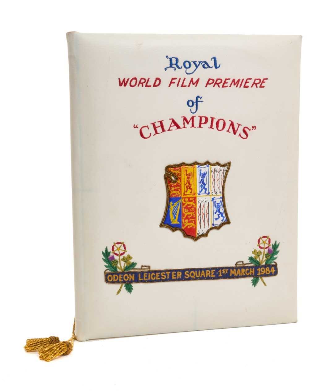 Lot 19 - H.M. Queen Elizabeth The Queen Mother, rare Royal World Film Premiere presentation program cover, for the Film "Champions" held at the Odeon, Leicester Square, 1st March 1984. The cover embroider...