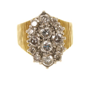 Lot Diamond cluster ring with a cluster of fourteen brilliant cut diamonds estimated to weigh 1.75cts, in claw setting on a textured yellow gold shank, engraved 18ct.