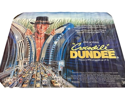 Lot 1537 - Six 1980s film posters from Odeon Cinema Crouch Street, including Crocodile Dundee (1 and 2), Dragnet, Robocop, Batteries Not Included etc