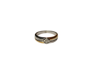 Lot 59 - Diamond single stone ring in rub over setting on yellow and white gold shank (stamped 750)