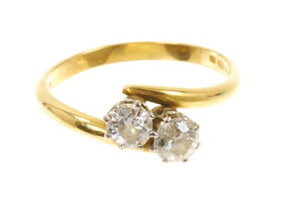 Lot 459 - Diamond two stone crossover ring
