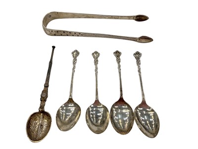 Lot 1007 - Pair of Georgian silver sugar tongs, silver anointing spoon, four silver teaspoons and a box of plated flatware