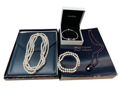 Lot 92 - Pandora silver charm bracelet in box, amethyst bead necklace with gold spacer beads and clasp and two cultured pearl necklaces with gold clasps