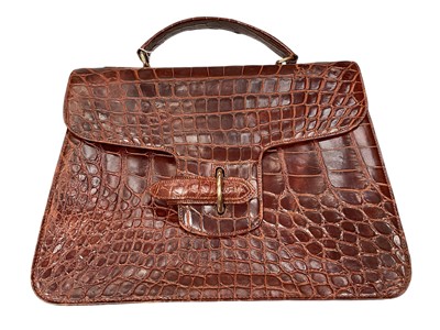Lot 2168 - Crocodile leather bag and vintage leather suitcase, (2).
