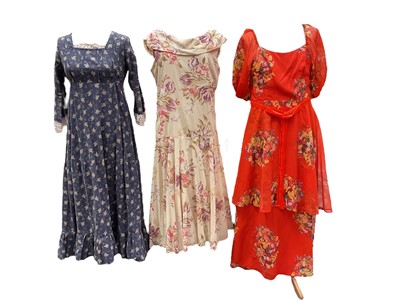 Lot 2122 - 1970s Laura Ashley Dyers and Printers label maxi with alteration of hand stitched lace trims, 1970's black party dress by Shubette, plus a small selection of 1980's dresses and blouses makes in...