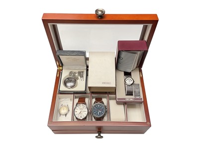 Lot 169 - Glazed watch case containing two Hugo Boss wristwatches and other watches