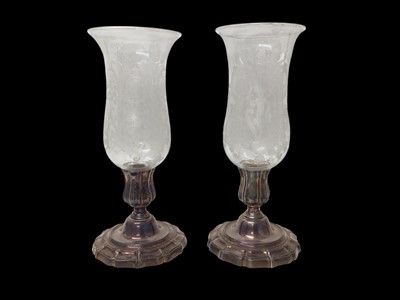Lot 1150 - Two Baccarat etched glass hurricane lamps on plated stands, 40cm high and 39.5cm high