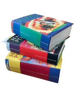Lot 1638 - Three First Edition Harry Potter books to include the Half-Blood Prince with rare page 99 printing error with the misprint 'eleven owls'. Order of The Phoenix and Deathly Hallows (3)