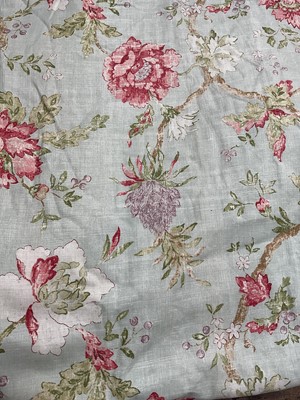 Lot 2129 - Pair of curtains large floral print on pale green ground. Lined and interlined. Measures 150cms across pinch pleat heading, drop 200cms, approximate.