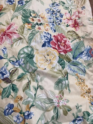 Lot 2130 - Three pairs of curtains printed brightly coloured floral design on pale yellow ground. Lined and interlined. Measures 90cms across pinch pleat heading, drop 190cms both approximate.