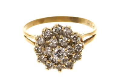 Lot 464 - Diamond cluster ring with a cluster of brilliant cut diamonds in tiered claw setting on 9ct gold shank. Estimated total diamond weight approximately 1ct.