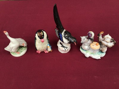 Lot 1161 - Four Russian porcelain figures including an inkwell with two bears eating, magpie, penguin and geese
