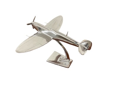 Lot 791 - Contemporary polished metal aircraft model in the form of Supermarine Spitfire, 30cm in length.