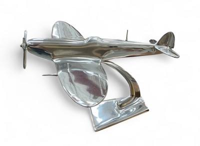 Lot 442 - Contemporary polished metal aircraft model in the form of Supermarine Spitfire, 30cm in length.