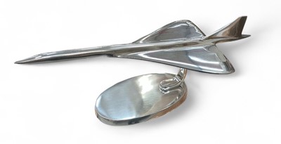 Lot 412 - Contemporary polished metal aircraft model in the form of Concorde, 41.5cm in length.