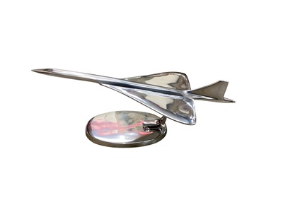 Lot 2533 - Contemporary polished metal aircraft model in the form of Concorde, 41.5cm in length.