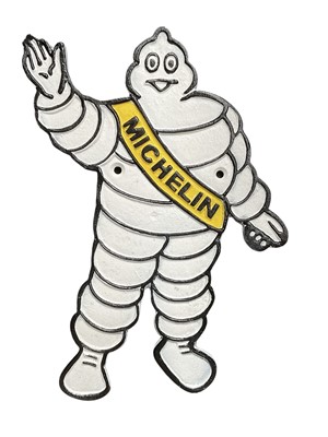 Lot Modern metal garage wall plaque of Mr Bibendum (The Michelin man), 34cm in overall height.