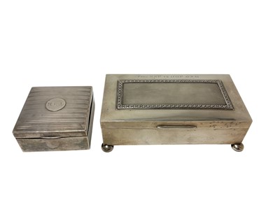Lot 249 - George V silver cigarette box of rectangular form with engine turned decoration and engraved inscription, raised on four bun feet (London 1928), maker Alexander Clark & Co Ltd