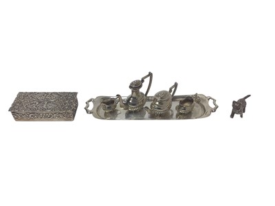 Lot 259 - Contemporary silver four piece miniature teaset (London 1976), maker A Chick & Sons Ltd together with a silver model of a cat and a silver box (various dates and makers), all at 3ozs.