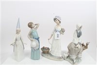 Lot 2101 - Four Lladro porcelain figures - lady with...