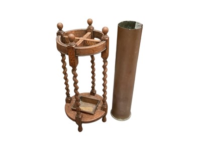 Lot 1516 - 1930s oak umbrella/stick stand and a brass shell case