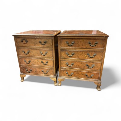 Lot 1448 - Pair of walnut bedside chests of four drawers