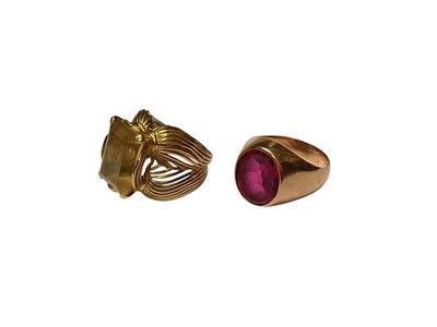 Lot 21 - Italian gold and citrine cocktail ring with stylised shoulders and continental gold and synthetic red stone signet ring (2)