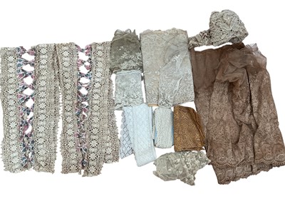 Lot 2145 - Quantity of antique lace items, including lengths of trim wide and narrow, bobbin made trim, handkerchiefs, embroidered mats etc.