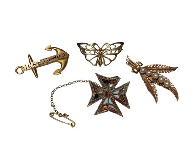 Lot 27 - Four gold brooches to include 9ct gold HMS Maidstone anchor, 9ct gold butterfly, 9ct gold and cultured pearls fern leaf spray and a yellow metal gem set Maltese cross brooch