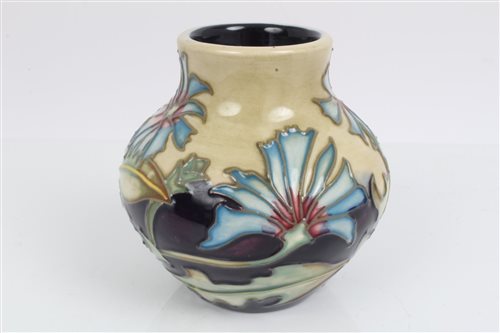 Lot 2116 - Moorcroft Pottery vase decorated with flowers...