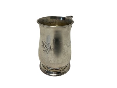 Lot 227 - George V silver tankard of baluster form, with engraved date and initials, scroll handle and raised on a circular foot, (Sheffield 1929), maker Thomas Bradbury