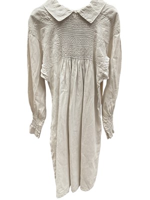 Lot 2147 - Antique farmer's smock. Hand stitched throughout. Gathered and stitched smocking, embroidered spirals, diamonds and zig zags across the chest, back, collar and cuffs. Reversible identical both sides.