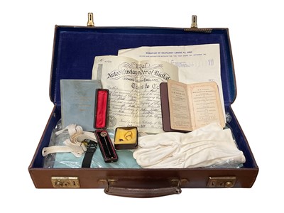 Lot 145 - 9ct gold masonic ring with a rotating enamel panel, 9ct gold masonic stick pin and other masonic items in leather case
