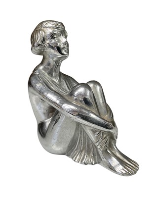 Lot 1920's / 30's chromium plated car mascot in the form of a seated woman, 9.5cm in overall height.
