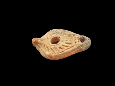 Lot 2455 - Roman pottery oil lamp