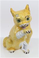 Lot 2132 - Mosanic yellow glazed pottery model of a cat...
