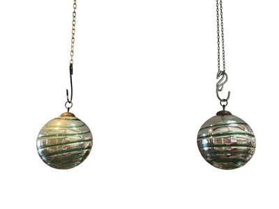 Lot 797 - Unusual pair of witch balls with green glass twist