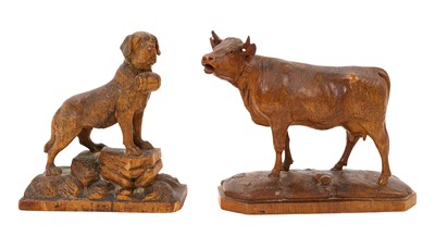 Lot 667 - Good quality antique Black Forest carved sculpture of a cow signed 'Fritz Buri', together with a similar quality carving of a dog (2)