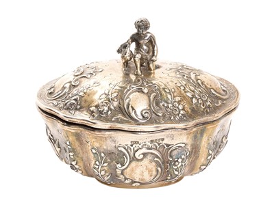 Lot 293 - 19th century Dutch oval silver box, the cast finial with boy and pheasant, repoussé decoration, (London import marks 1899), 10oz