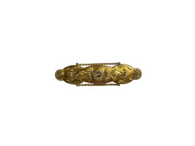Lot 15 - Victorian 15ct gold bar brooch with central diamond and cantilli decoration