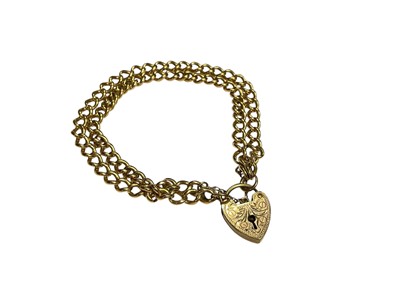 Lot 17 - 18ct gold double row curb link bracelet with 9ct gold padlock clasp