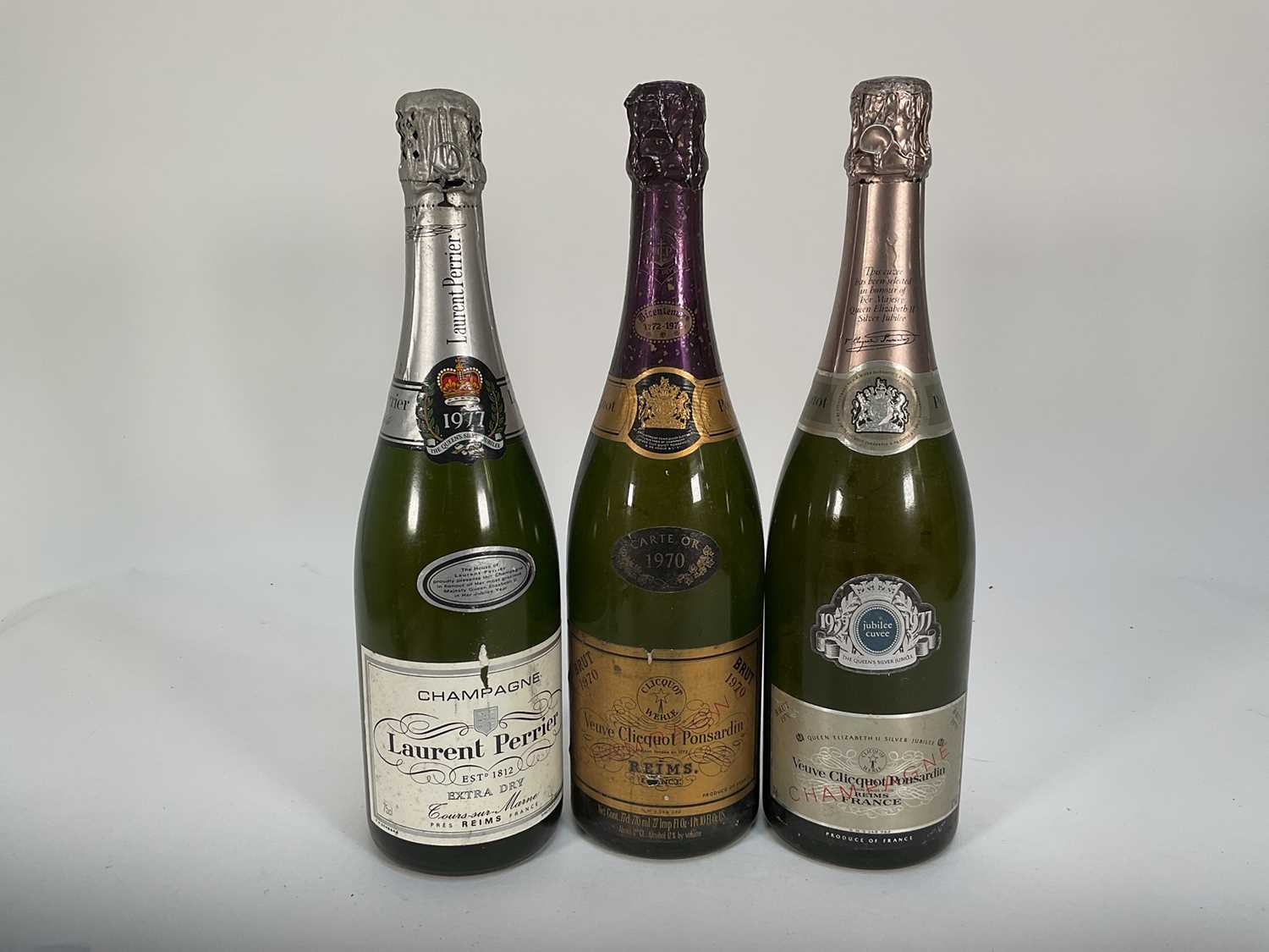 Lot 11 - Three bottles of champagne, Veuve Clicquot Ponsardin 1970, another 1970 Silver Jubilee Veuve Cliquot and a bottle of Laurent Perrier 1977 champagne (3)