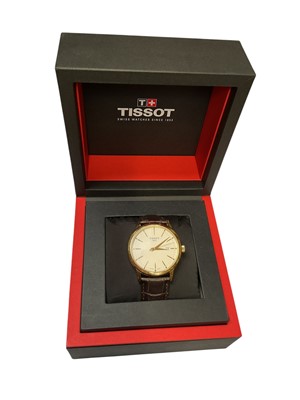 Lot 40 - Tissot 'Classic Dream' gold plated stainless steel quartz wristwatch, 42mm diameter, on Tissot brown leather strap, boxed with original reciept