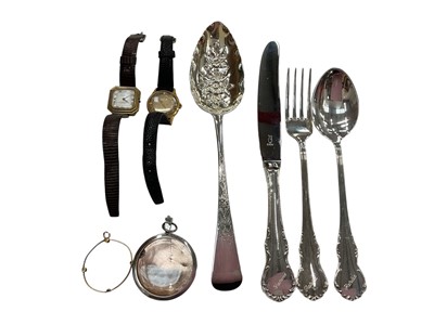 Lot 977 - Georgian silver berry spoon, Victorian silver glazed round locket, yellow metal mount, two vintage wristwatches and a plated three piece spoon, knife, fork set