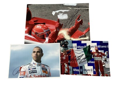 Lot 1472 - Two x Michael Schumacher hand signed pictures and hand signed Lewis Hamilton profile picture, plus Heroes of Grand Prix 6 DVD box set