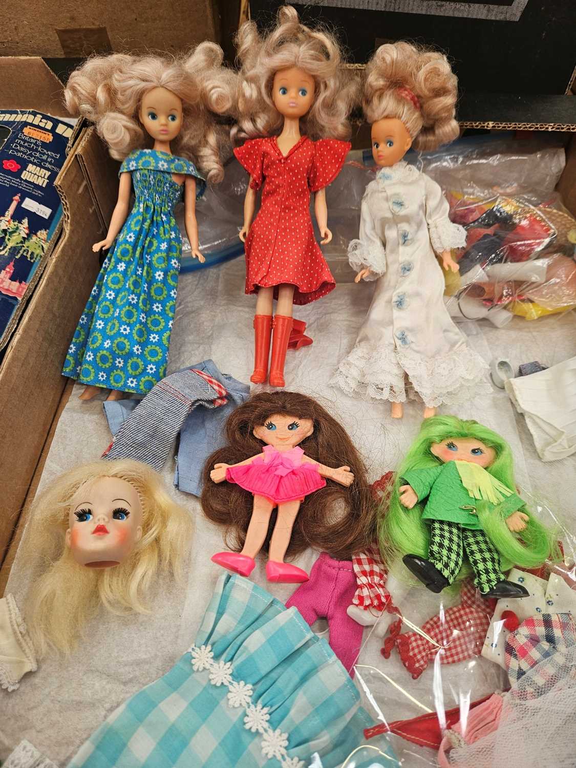 Lot 2060 - Group of small fashion dolls, head marks include H17, 110, A10, 210 with mixed clothing and accessories. Two Flatey dolls plus bicycle, Sindy head 03055X and three other teenage dolls. In two...