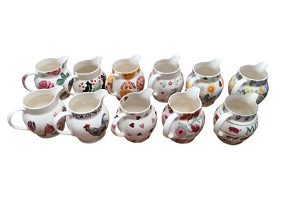 Lot 1183 - Collection of 11 Emma Bridgewater jugs in various designs including Rise & Shine, and one decorated with hares dared 2023