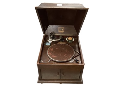 Lot 2230 - HMV oak cased wind up gramophone with a small selection of jazz and other records