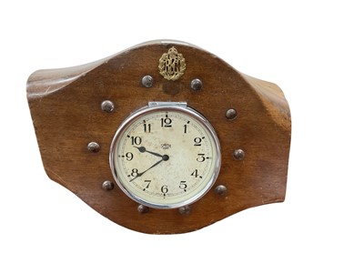 Lot 750 - First World War period wooden propeller boss, mounted with a Smiths 8 day clock, and Royal Flying Corps cap badge, 40cm in overall length.